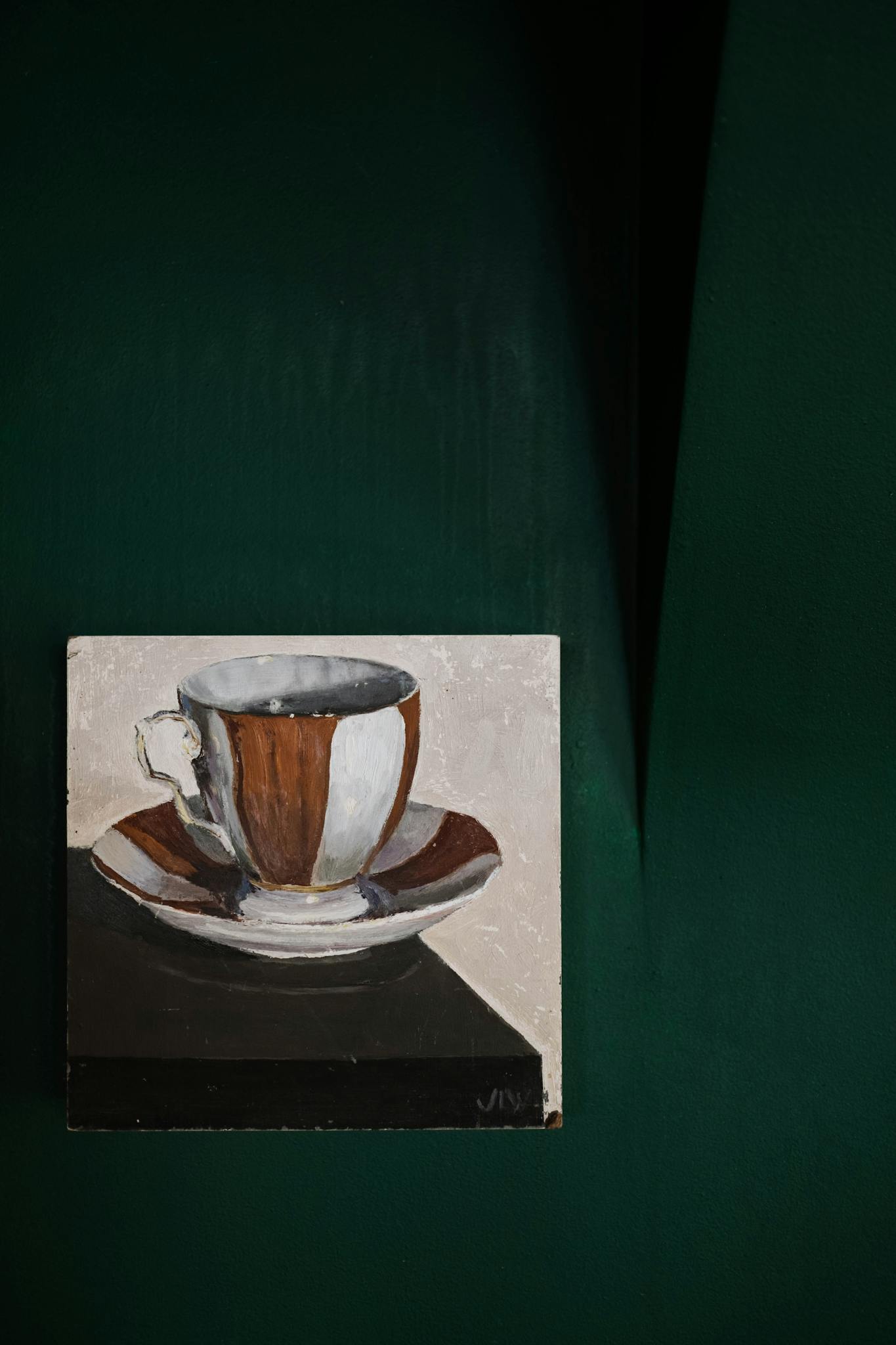 Artistic still life painting of a cup against a deep green background for elegant decor.